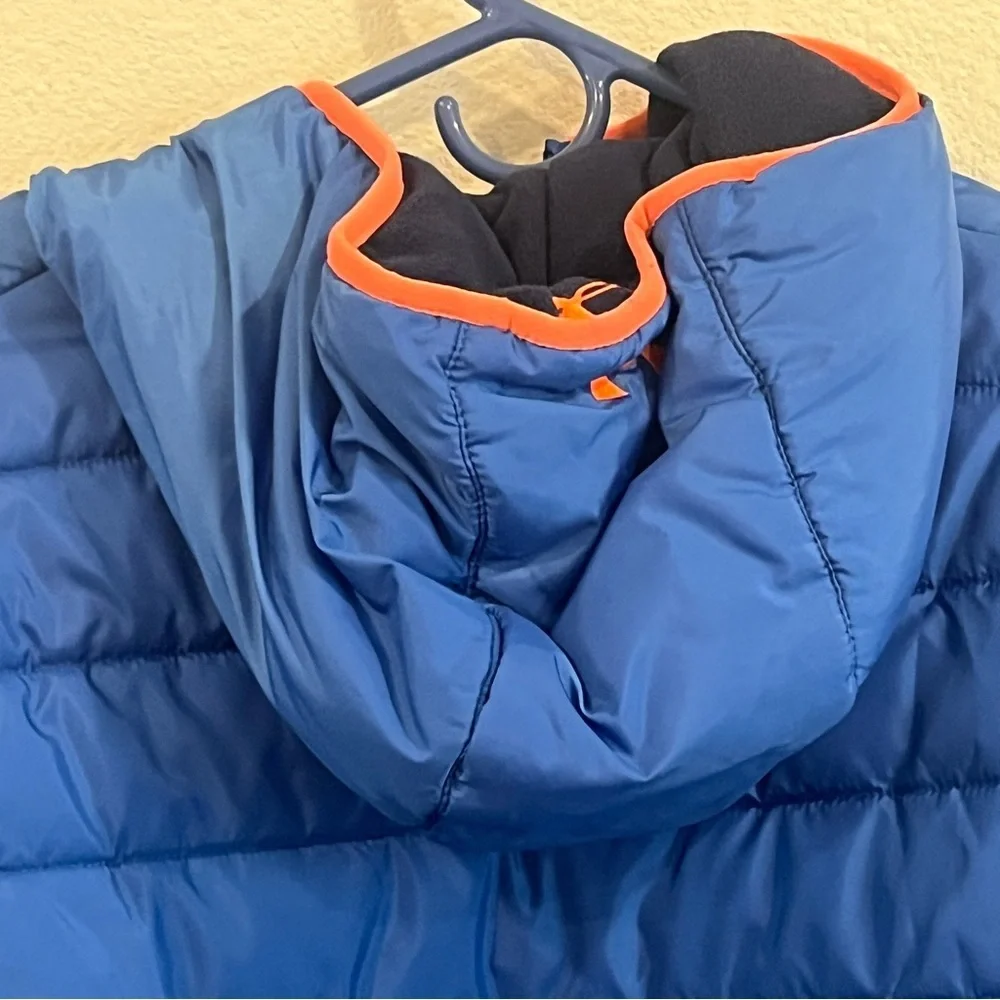 Under Armour kids size X-Large blue and orange reversible puffer jacket hooded
